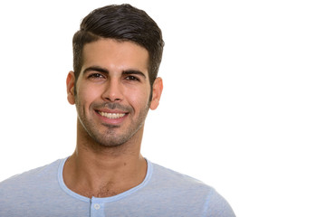 Fototapeta premium Studio portrait of young handsome Persian man smiling
