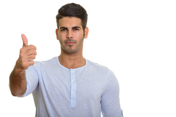 Naklejka premium Young handsome Persian man giving thumb up