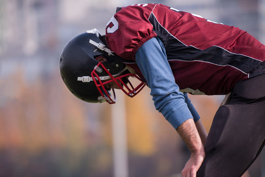 american football player resting after hard training
