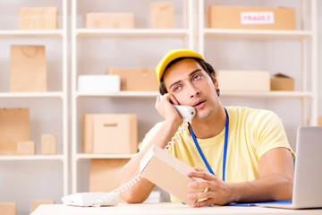 Handsome contractor working in box delivery relocation service 