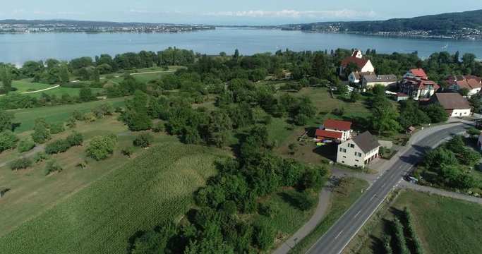 Aerial view Lake Constance and Horn with Reichenau in the background 4K flight forward