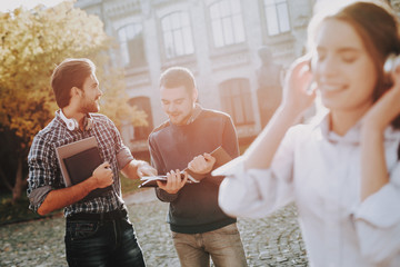 University. Headphones. Girl. Happy. Friends.