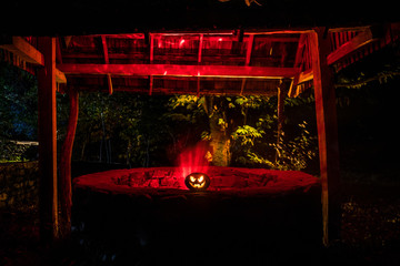 Halloween Pumpkins On Wood In A Spooky Forest At Night