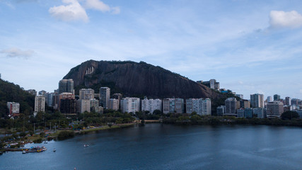 aerial view of the drone of the lagoon in rio de janeiro and copacabana, at dusk