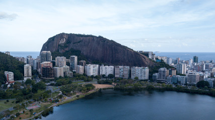 aerial view of the drone of the lagoon in rio de janeiro and copacabana, at dusk