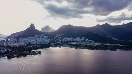 Fotobehang aerial view of the drone of the lagoon in rio de janeiro and copacabana, at dusk © Marcos