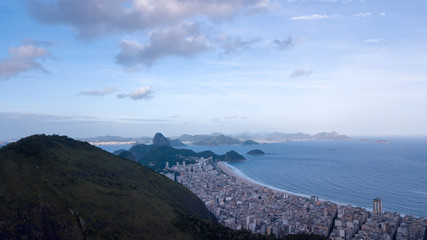 aerial view of the drone of the lagoon in rio de janeiro and copacabana, at dusk