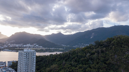 aerial view of the drone of the lagoon in rio de janeiro and copacabana, at dusk