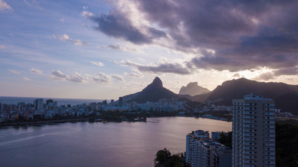 aerial view of the drone of the lagoon in rio de janeiro and copacabana, at dusk
