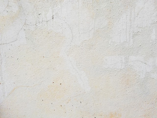 Old white cement wall with crack