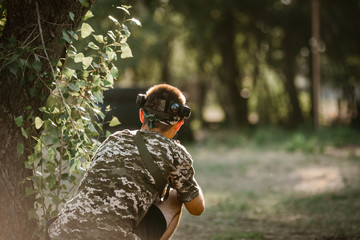 Back view of lasertag player wearing protective uniform