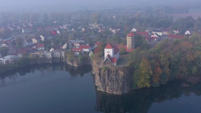 Church Overlooking a Small and Beautiful Lake on a Foggy Morning