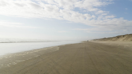 Fototapeta na wymiar Driving 90 mile beach during low-tide, New Zealand