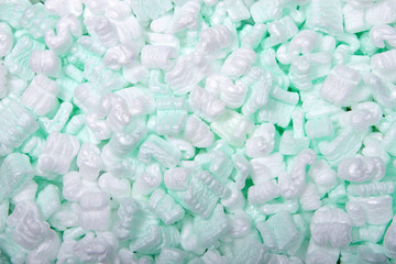 Flat lay of of foam packing peanuts. Foam peanuts, or foam popcorn, packing peanuts or packing...