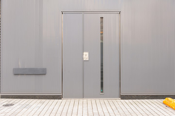 sidewalk by street wall & door