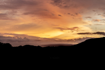 A dramatic sunrise over the city of Patong from the southern hillside.