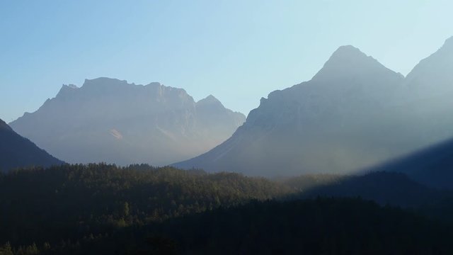 Austria, Tyrolean Alps. Road to Fern pass. Wonderful landscape at the mountain and wood during sunrise. The Zugspitze peak on the back
