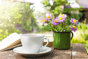 A Cup of tea on a wooden table.