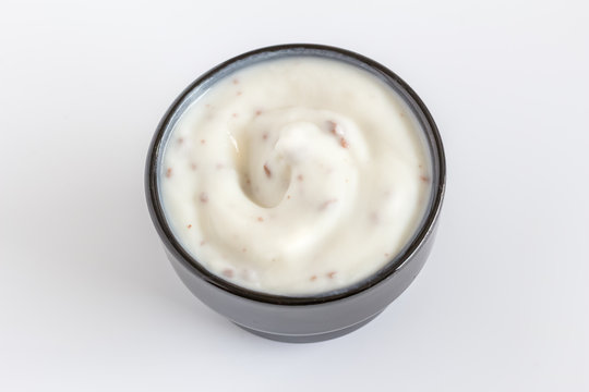 Choc chip yogurt in a small black cup close up - Yoghurt close up