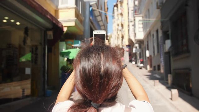 Young Tourist Woman Taking Pictures of Istambul Streets Using Mobile Phone. Turkey. 4K Slowmotion.