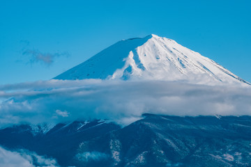 Close up top of beautiful Fuji mountain (fujisan) with snow cover on the top with could, Japan