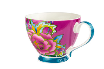 Mug cup for tea or coffee brightly decorated in pink blue and yellow colours - hand painted oriental style cup isolated on white background