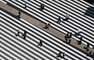 Aerial view of people crossing a big intersection in Tokyo, Japan 