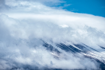 Close up top of beautiful Fuji mountain (fujisan) with snow cover on the top with could, Japan