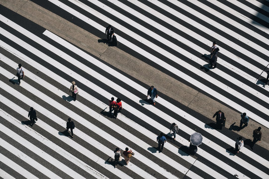 Aerial view of people crossing a big intersection in Tokyo, Japan 