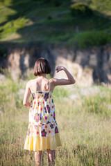 Obraz premium The girl shows her muscles.