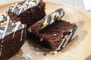 Chocolate Brownie On a plate of wood Cut into small pieces.