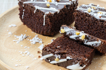 Chocolate Brownie On a plate of wood Cut into small pieces.