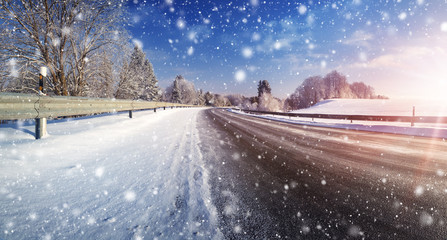 Fototapeta na wymiar Car on winter road covered with snow