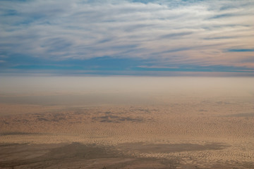Panoramic view of hazy Arabian desert with sand dunes at Al Ain, UAE