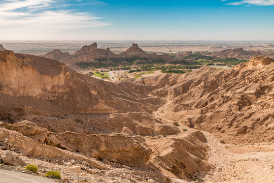 Scenic Winding Road In Al Ain, UAE: Jebel Hafeet Mountain Panoramic View Towards Green Mubazzarah Resort 