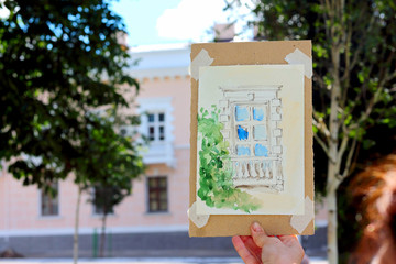 Fototapeta premium Watercolor drawing of the old city against the background of the city. City sketching, street sketches.