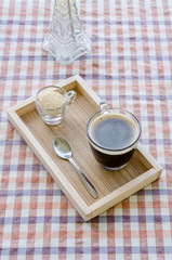 Cup of hot coffee and brown sugar