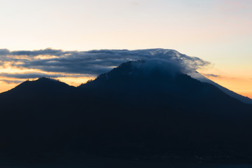 Sunrise view from Gunung Batur volcano in Bali with visible Mount Agung volcano