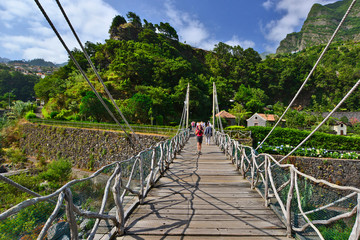 Group of tourists on the bridge leading to the caves/lava tubes and volcanism centre in Sao Vicente...