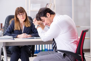 Man and woman discussing in office