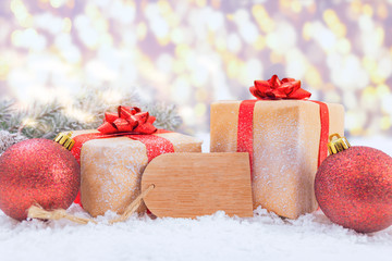 Gifts with christmas balls against a blurred background