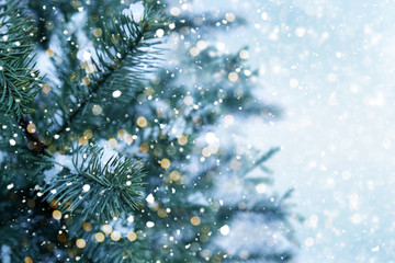 Closeup of Christmas tree with light, snow flake. Christmas and New Year holiday background....