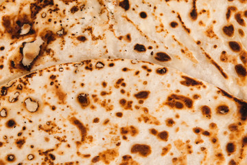 Background. Texture of fried dough, tortilla or pancake. Past background with dark circles.