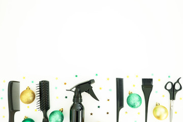 Christmas hairdresser frame with spray, combs, scissors and decoration on white background. Stylish holiday concept. Flat lay, top view