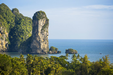 The scenic view on a sea with islands and the cliffs at sunset