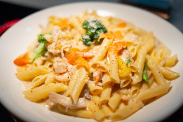 macaroni with cheese in the white plate