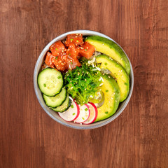 Hawaiian tuna poke salad with wakame, vegetables, and copy space