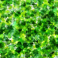 A seamless pattern with watercolor drawings of shamrocks, Irish clovers, a vibrant green St Patrick's Day repeat print