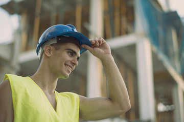 Construction worker in construction site in summer day