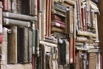 Fototapeta na wymiar Library background - Wall with books on the street - Books textured background (Pesaro, Marche, Italy)